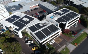The SiteHost building, seen from air, with over 300 solar panels on the roof.